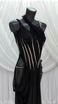 BLACK BODYSUIT WITH BLACK MESH DRAPE AND CRYSTAL DETAIL.